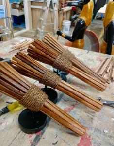 Individually fabricated wooden torches. Wood wrapped around UL Edison bulb bases 